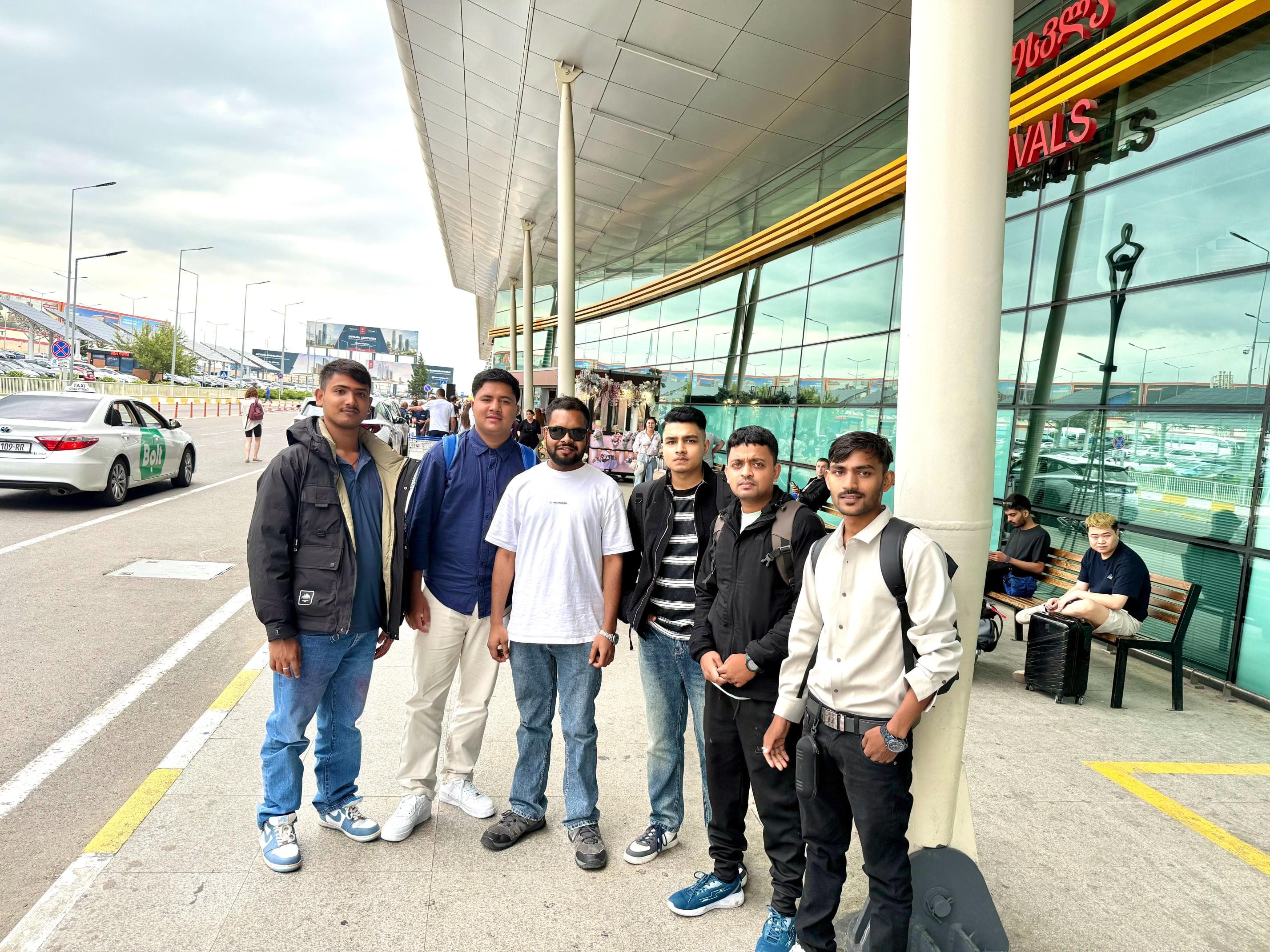 A group of BRS students outside the arrivals hall at Tbilisi International Airport